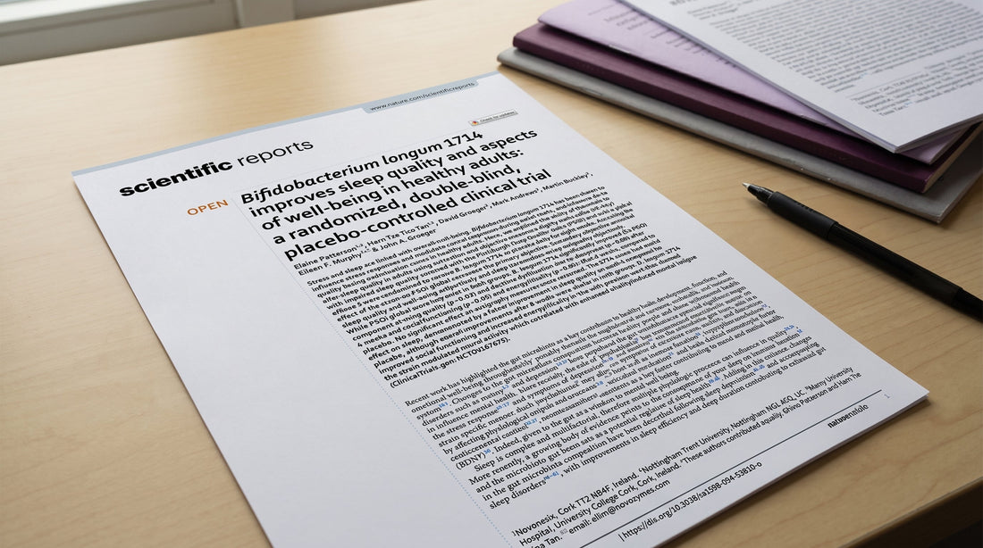 Printed scientific paper on Bifidobacterium longum and sleep quality on a desk.
